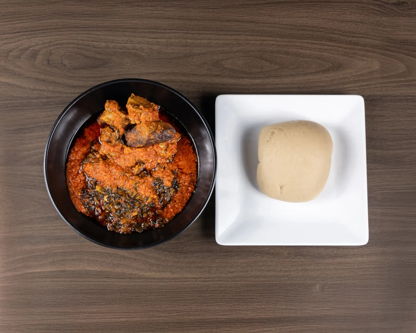 Rich red soup served with swallow at M&M African Kitchen